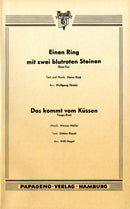 Einen Ring mit zwei blutroten Steinen